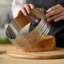 Justerbar kakedeler 24-30x8 cm stål